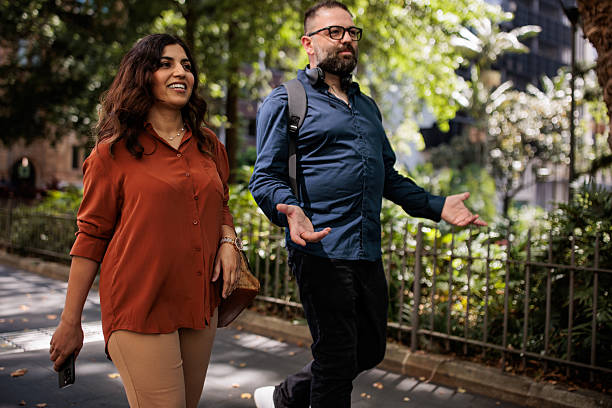 Colleagues Walking to Work Through Park in Sydney