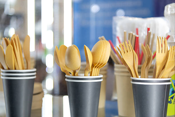 istock Plastic utensils displayed in cups at a sustainable market event 2221910891