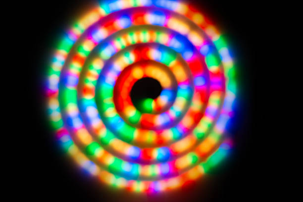 Abstract colorful lights in spiral circle, abstract holiday background