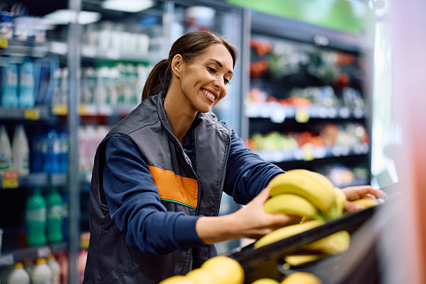 istock Happy grocery store worker at fresh fruit section. 2221917126