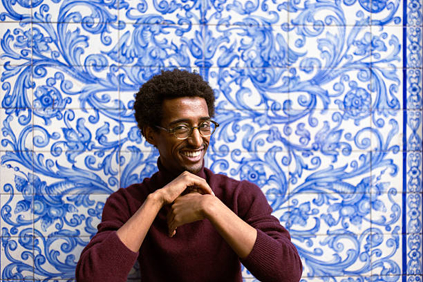 istock Smiling Man with Blue Ornate Background 2221917355