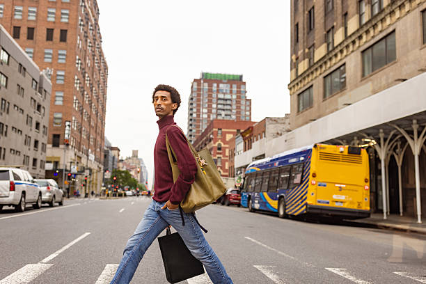 Young Man Walking in City Street