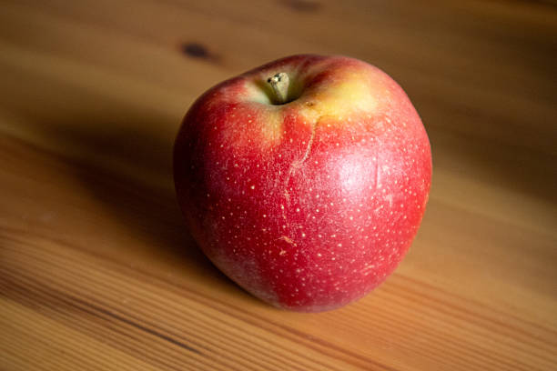 istock Healthy Red Apple on Rustic Wooden Table 2221917793