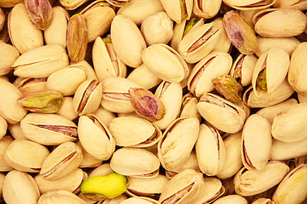 istock pistachios close up. background nuts pistachio. open pistachio isolate 2221918623