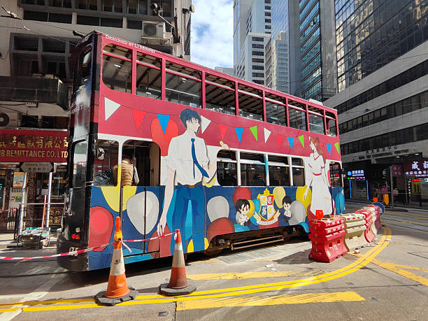 Colourful Double decker tram riding in Sheung Wan district, Hong Kong Island.