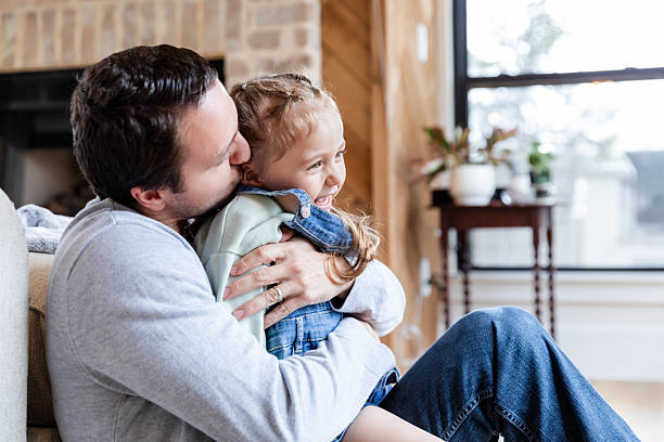 istock Happy father and daughter bonding at home 2221920736