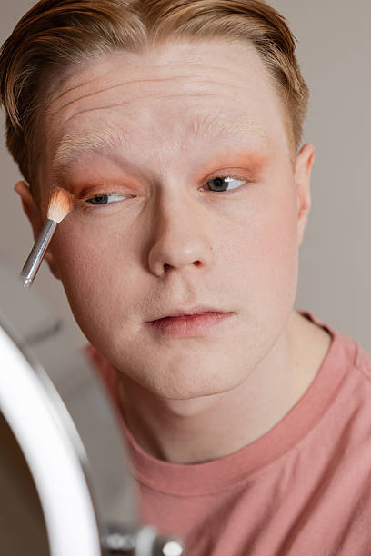 istock Man Applying Eyeshadow with Brush Vertical Extreme Close Up 2221924741