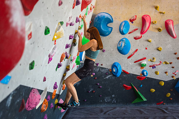 istock Focused Woman Climbing Indoor Bouldering Wall 2221929464