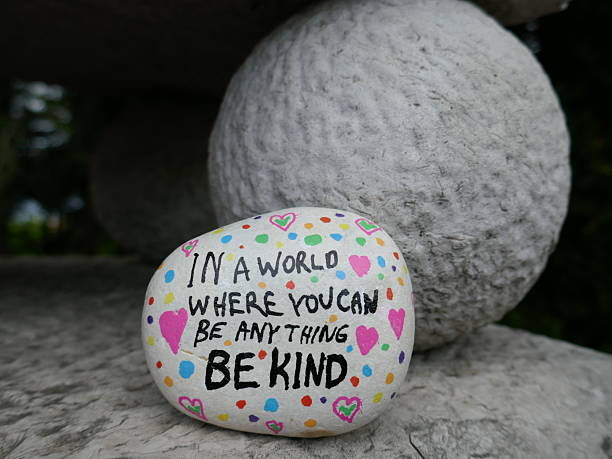 istock Old stone statue ball with be kind kindness rock 2221938156