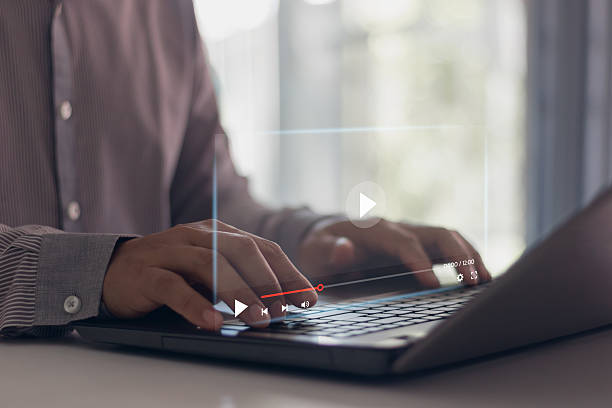 istock Video streaming on internet concept. Businessman watching video on laptop. Online education, e-learning, live stream broadcast, digital media communication, business advertising platform, remote work. 2221942966