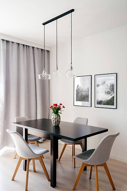 istock Modern dining space with minimalist decor and elegant lighting 2221945620