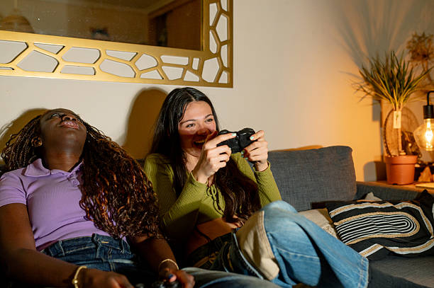 istock Interracial lesbian couple playing video games at home 2221945719