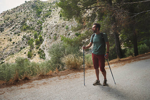 istock Hiker Exploring Scenic Mountain Trail Enjoying Nature 2221949734