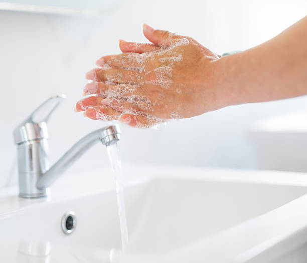 istock Woman Washing Hands 2221950324