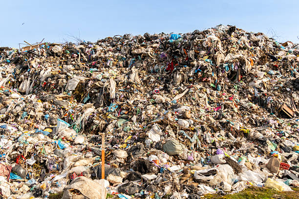 istock Massive Accumulation of Garbage and Waste Materials in Landfill Site Under Clear Sky 2221952466