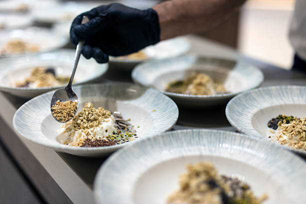 Chef reparing cereal breakfast dishes in a commercial kitchen