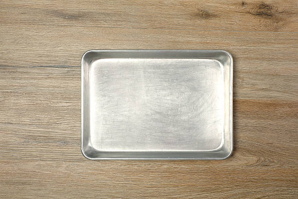 istock Metal empty oven tray on wooden table 2221957156