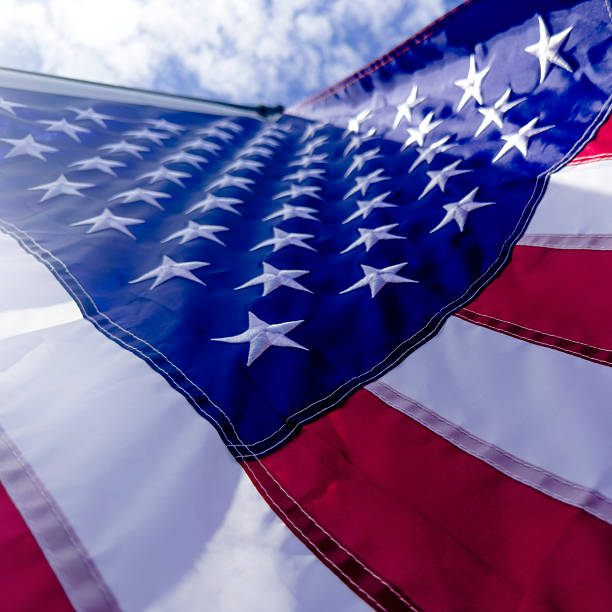 istock Close Up American Flag at flagpole 2221958348