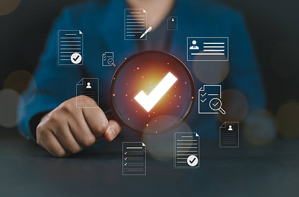 istock Businessman Audit documents, quality assessment management With a checklist, business document evaluation process, plan review process. Market data report analysis and consulting. 2221959391