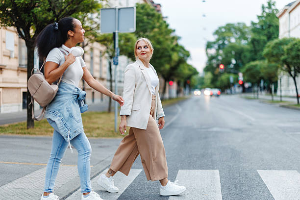 istock Two Friends Enjoy Commuting in the City 2221961724