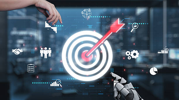 istock Digital Target Achievement Concept with Robotic Hand and Virtual Elements Representing Goals, Analytics, and Collaboration in Modern Business Environment. Auvana 2221965894