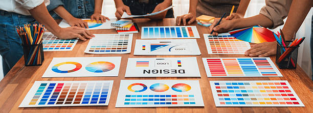istock Graphic designer brainstorming logo and graphic arts at workshop. Scrutinize 2221965908