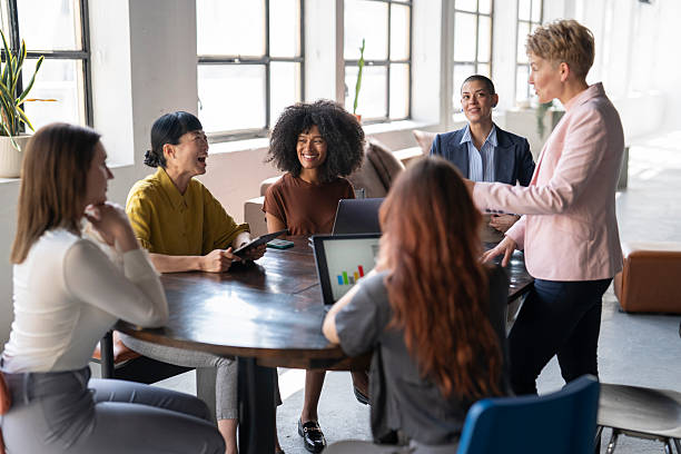 istock Businesswomen having a productive meeting around a table 2221966354