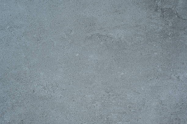 istock Blue toned concrete wall texture background with fine details and surface grain 2221967117