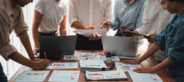 istock Analyst team utilizing BI Fintech to analyze financial dashboard. Scrutinize 2221968238