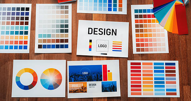 istock Various color palette idea papers arranged on workspace for designer. Scrutinize 2221968508