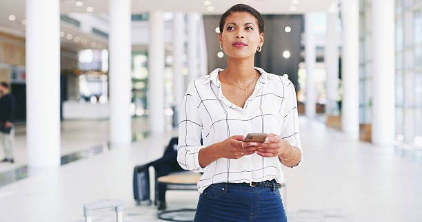 istock Woman, thinking and planner with phone in office, event coordinator and schedule venue. Workplace, creative employee and problem solving for guest list, online and female person at agency for project 2221972896