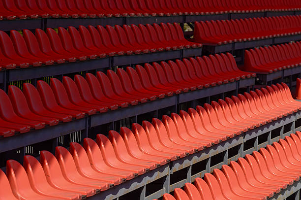 The empty seats are red and arranged in rows. Concept of emptine in Chișinău, Chisinau, Moldova