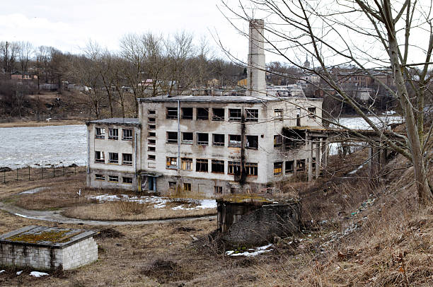 Abandoned industrial building by the river in Narva, Ida-Viru County, Estonia