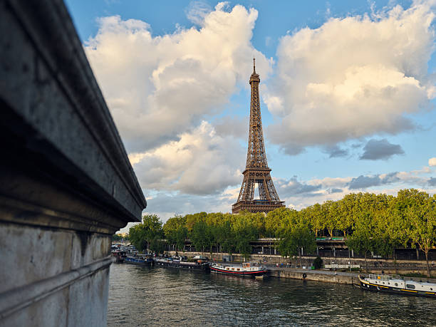 istock Eiffel tower rising above the seine river 2221979663