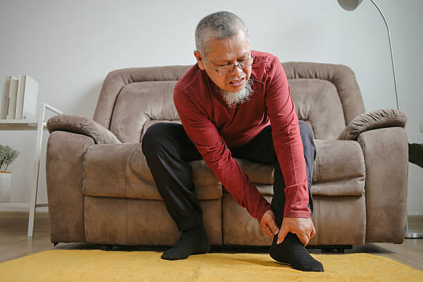 istock Elderly Man Suffering Sprain Legs And Cramps 2221985063