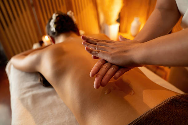 istock Masseuse prepare oil massage procedure for customer at spa. Quiescent 2221987477
