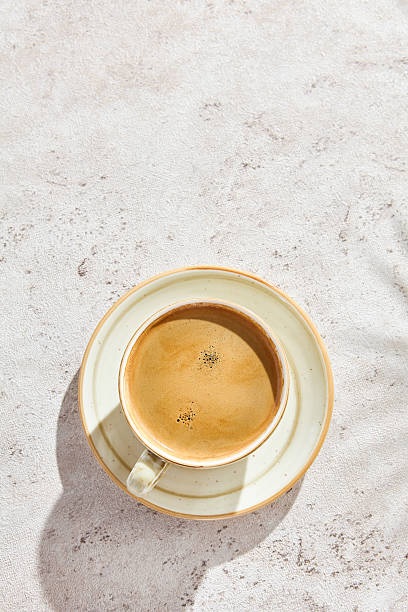 istock Espresso coffee cup with crema, bright lighting, overhead composition 2221989078