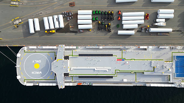 istock Wind Turbine Towers & Cargo Ship 2221989780