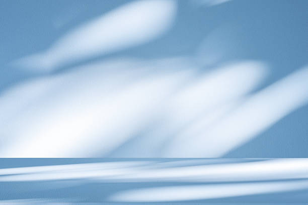 istock Studio style background wall decoration presentation uses white and blue tones. with shadows cast from a nearby window, concept creating a decorative 2221989893