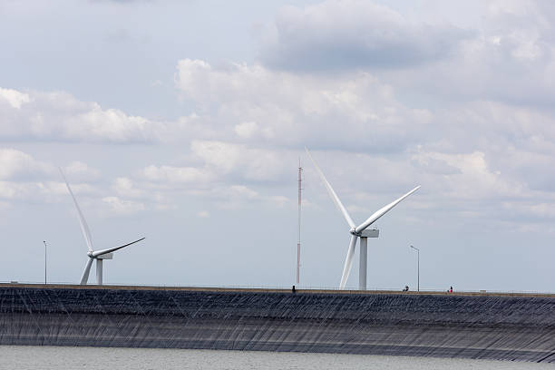 istock Wind Turbines on Dam Wall with Water 2221989896