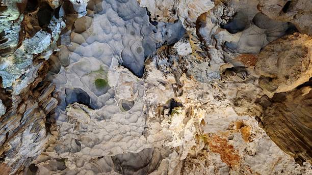 istock Majestic stalactites and rugged limestone formations illuminated by soft lighting in Thien Cung Cave, Ha Long bay, Vietnam. 2221991312