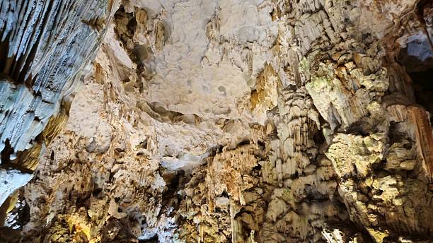 istock Majestic stalactites and rugged limestone formations illuminated by soft lighting in Thien Cung Cave, Ha Long bay, Vietnam. 2221991492