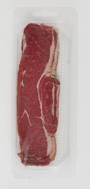 istock Fresh sliced beef stacked on a clear plastic tray isolated nature background with clipping path 2221993975