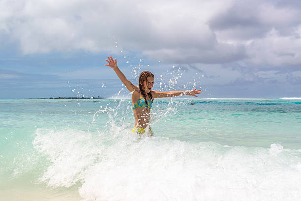 istock Cute Girl Playing at the Beach 2221996835