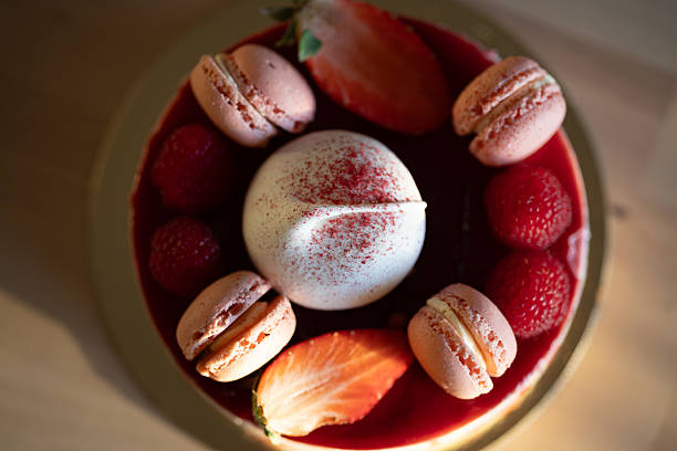 istock Gourmet Dessert with Raspberry Macarons and Meringue on Golden Plate 2221997867