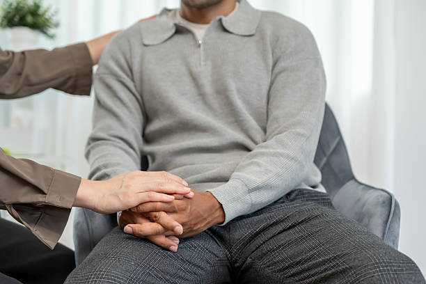 istock psychiatrist hold hand support each while discussing family issues. doctor encourages and empathy man suffers depression. psychological, save divorce, Hand in hand together, trust, care 2222000846