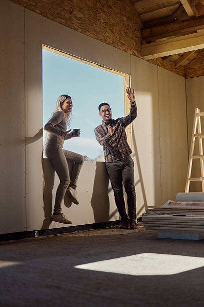 istock Happy couple making plans inside of their developing house. 2222002041