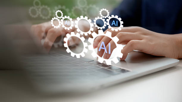 istock Hands typing on laptop with AI gear icons, representing artificial intelligence-powered tools, automation systems, productivity technology, and digital transformation. 2222005909