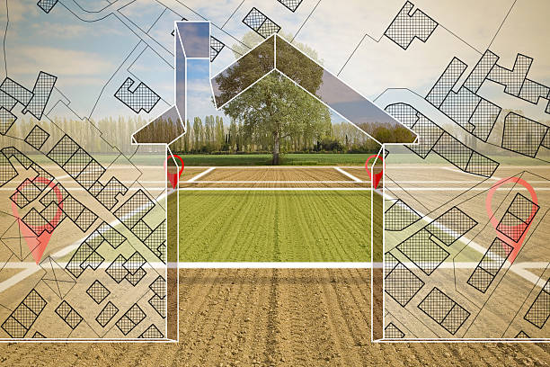 istock Land plot management - Imaginary city map with buildings and land parcels - real estate concept with a vacant land on agricultural field available for building construction 2222006139