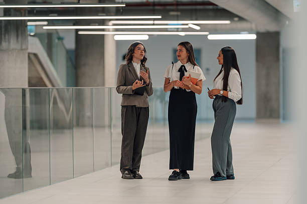 istock Businesswomen discussing work in modern office building 2222006617